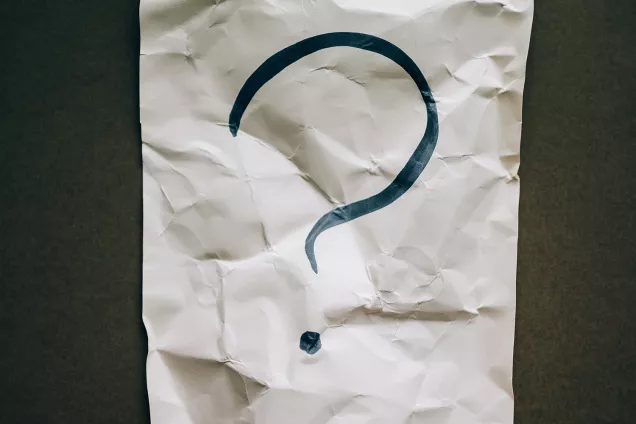 Question mark on a paper. Photo.