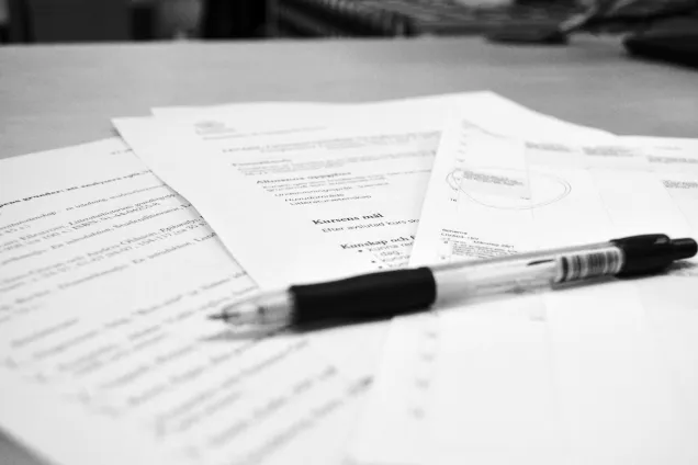 Pen on course syllabus. Photo