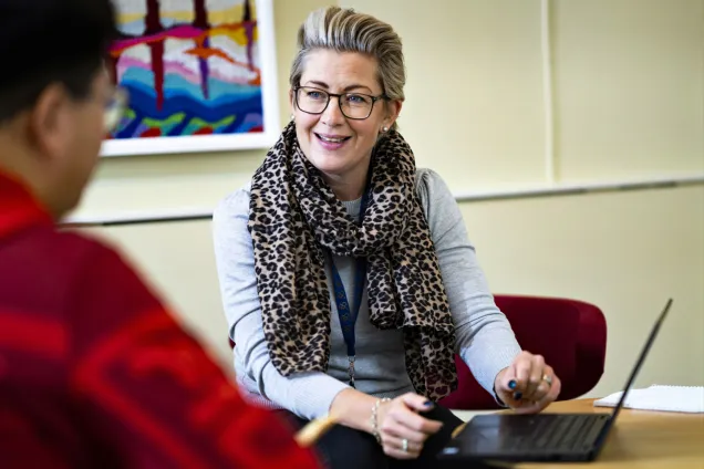 Two individuals in a study counselling meeting.