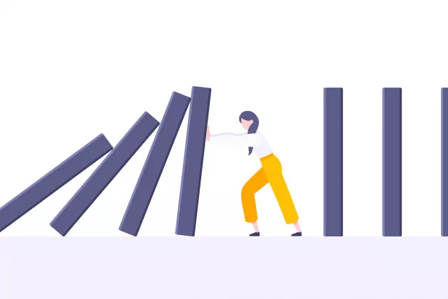 Illustration av en figur som försöker stoppa dominobrickor från att falla.